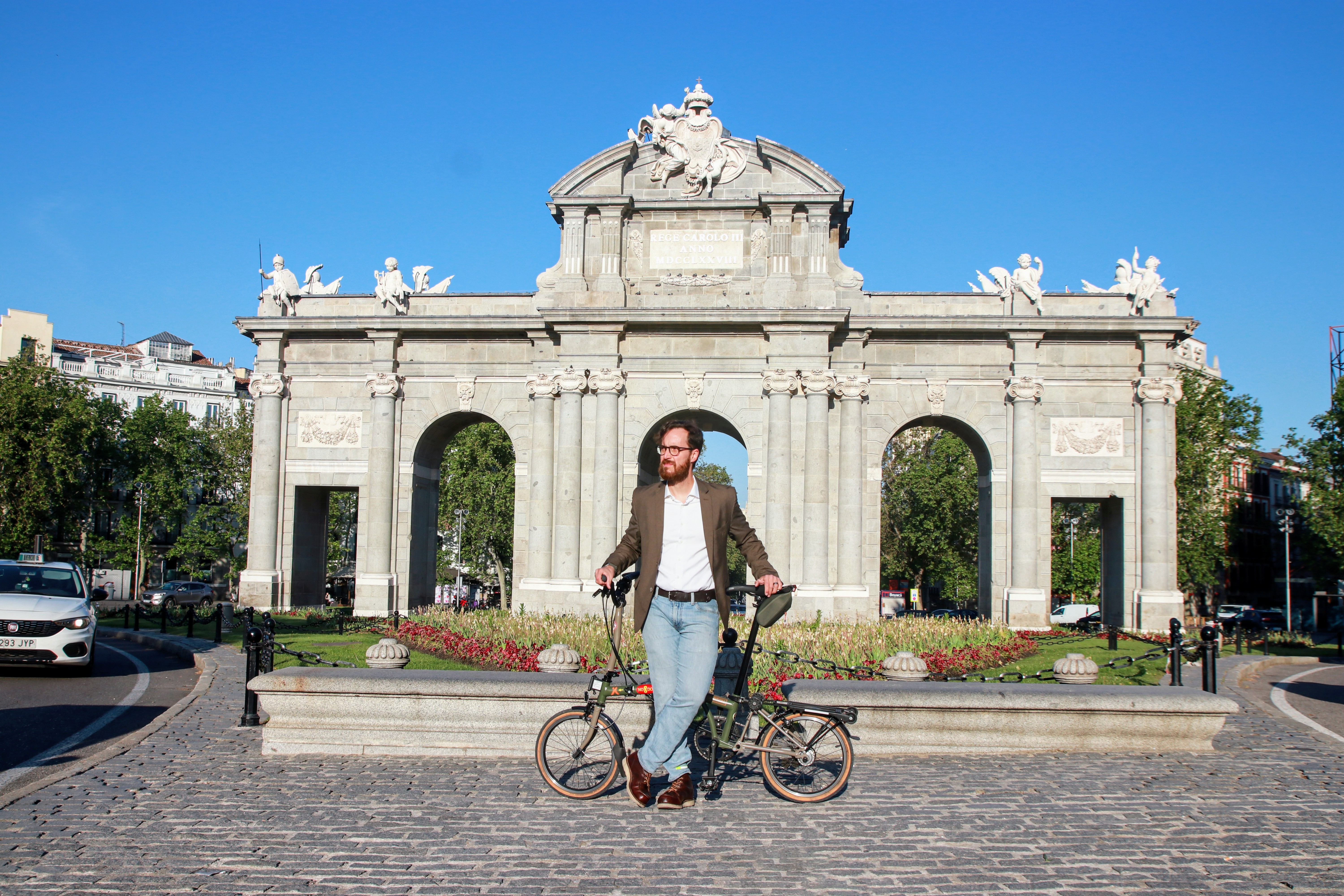 Cycling past the Royal Palace of Madrid